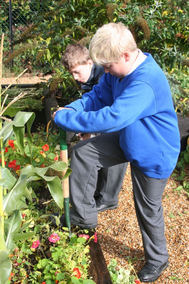  2 children gardening