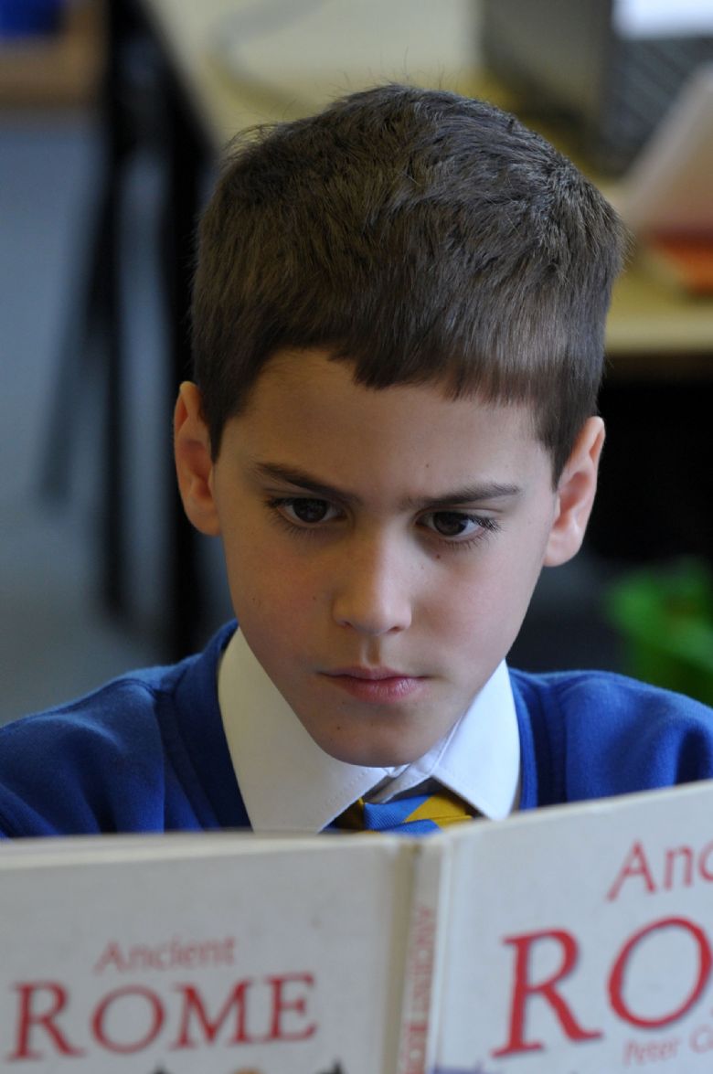  A pupil reading a book about the Romans