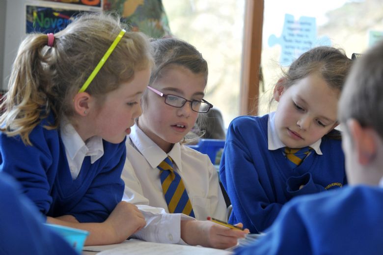  Children working on a story together